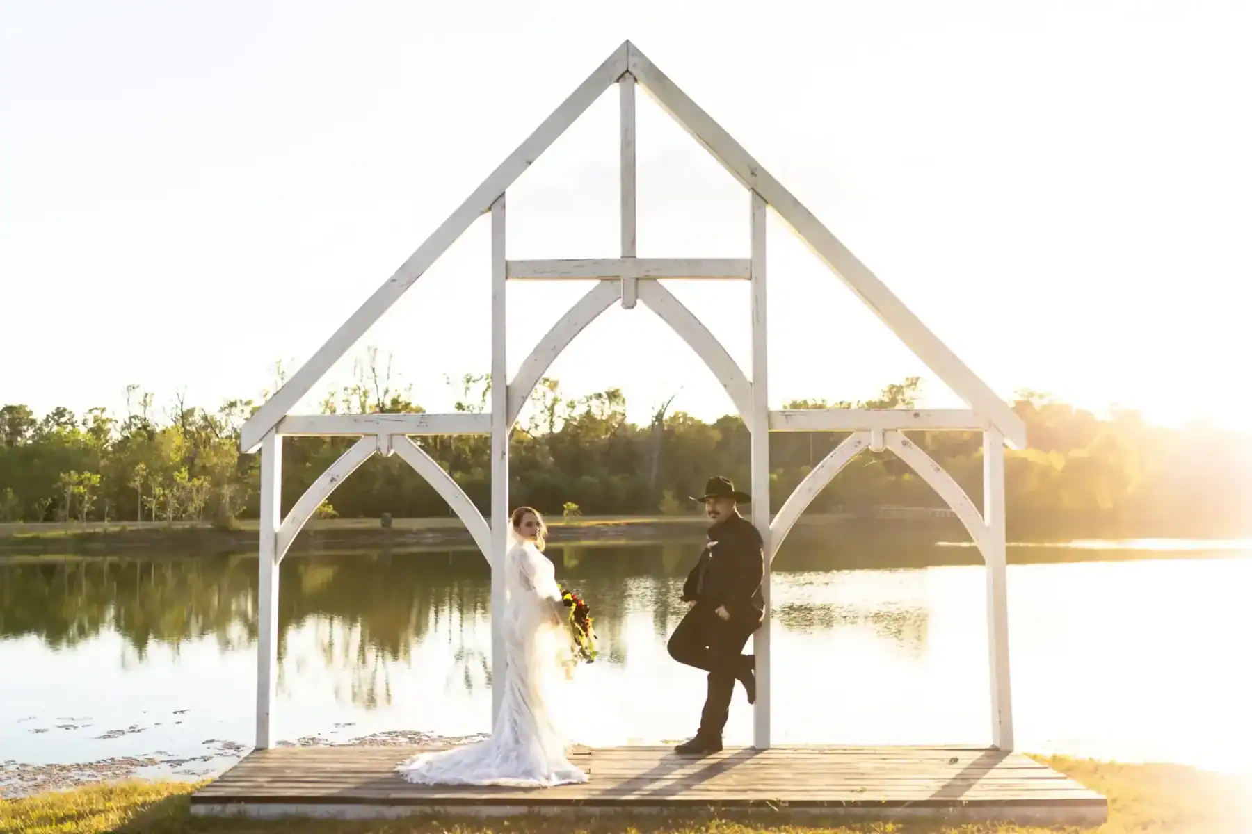 Sunset lake wedding ceremony at The Barn at Four Pines Ranch in Texas Sunset lake wedding ceremony at The Barn at Four Pines Ranch in Texas