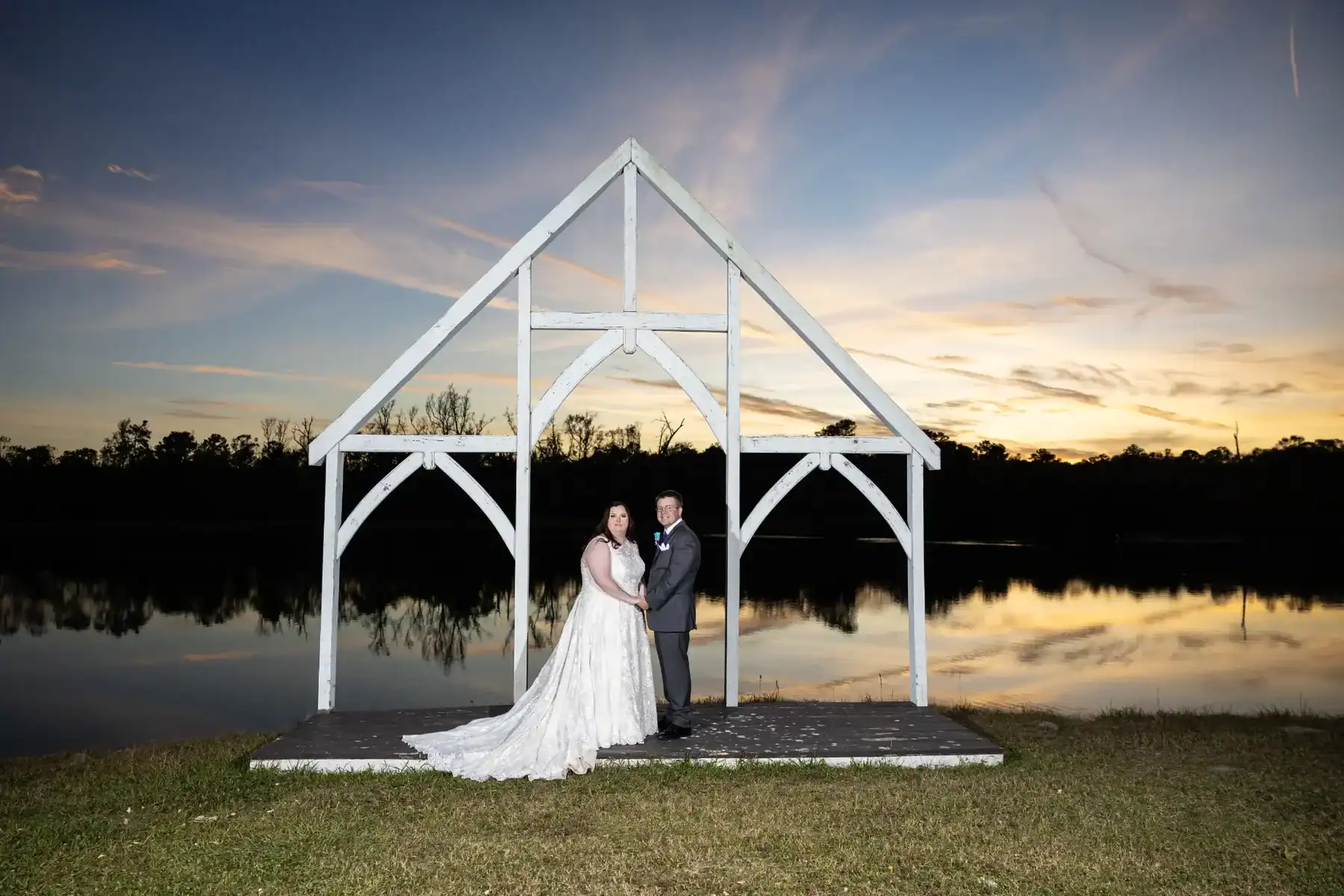 Sunset lake wedding venue at The Barn at Four Pines Ranch TX