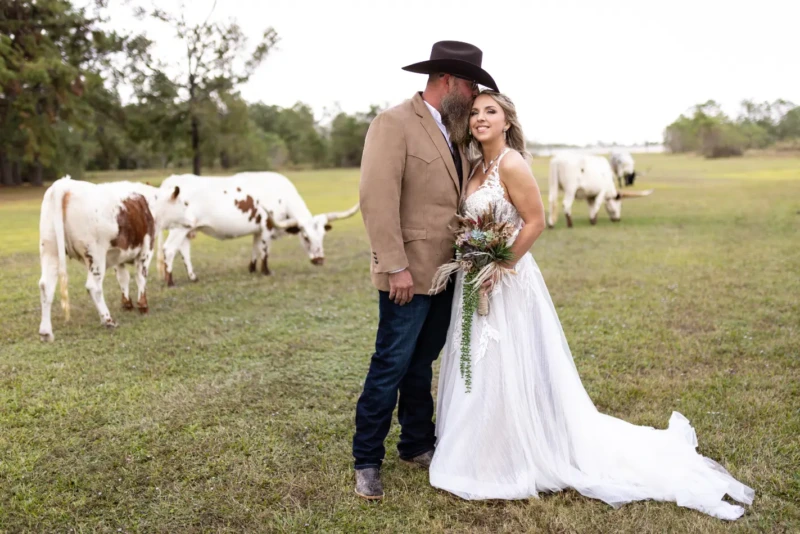nature wedding with longhorns in texas at the barn at four pines ranch
