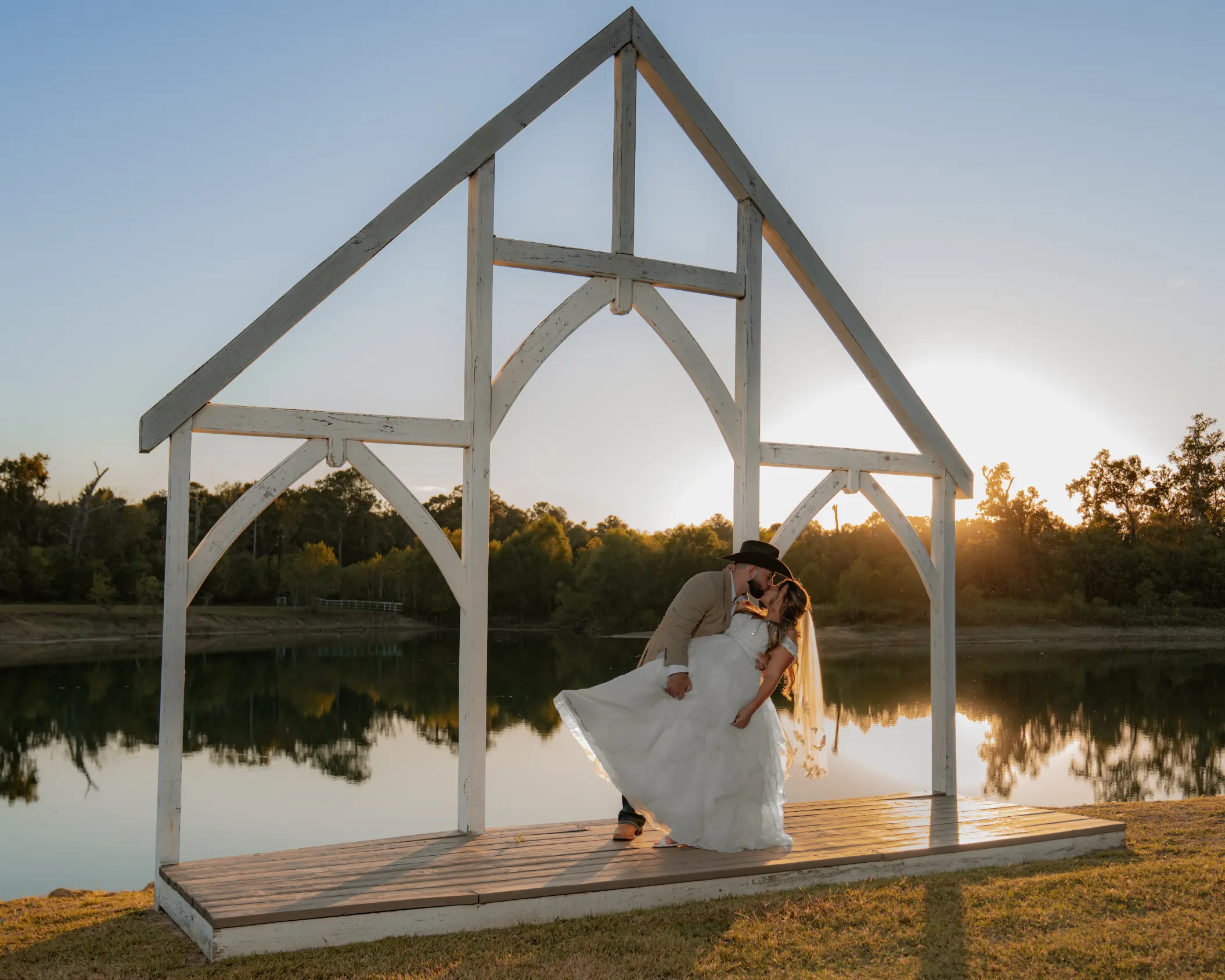 private ranch estate wedding venue in houston tx Lakeside wedding ceremony at Four Pines Ranch near Houston